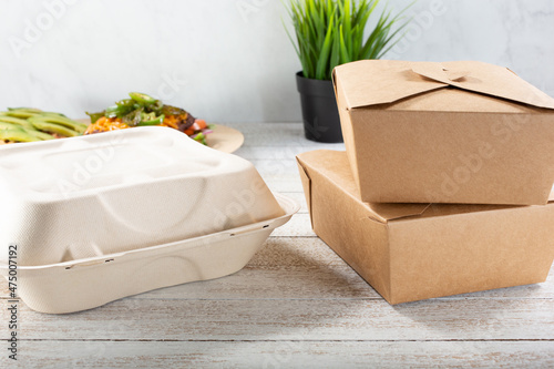 A view of a variety of to-go containers featuring clamshell and folding boxes.