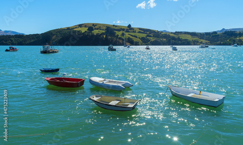 Dinghy and Boats at Akaroa Beach on the Banks Peninsula, southeast of Christchurch, South Island, New Zealand