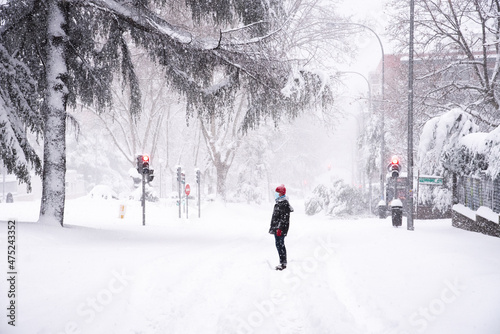 People walking on a street during heavy snow storm