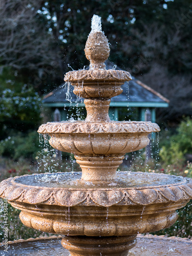 Vertical shot of a beautiful water fountain in a park