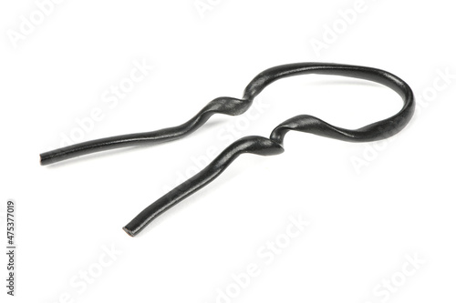 Black plastic coated wire tie used for a variety of things isolated on white background.