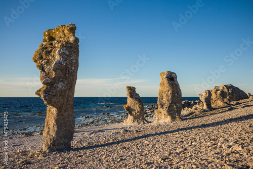 Sweden, Faro Island, Langhammars Area, Langhammar coastal limestone rauk rock, sunset