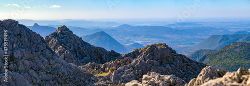 Panoramic photograph of the mountainous landscape of the Sierra de Grazalema, in Andalusia, Spain.