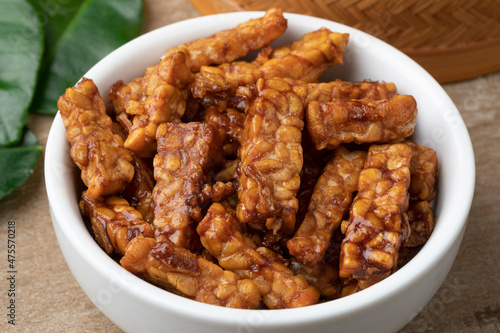 Bowl with fresh homemade Indonesian sambal tempeh goreng close up 