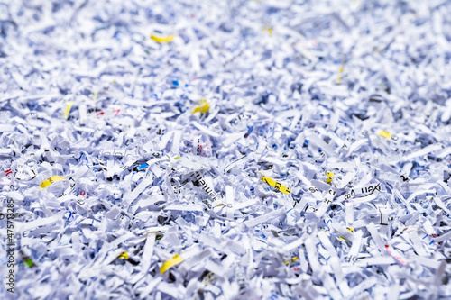 A pile of shredded papers, documents and files. Data protection, destruction or erasure background.