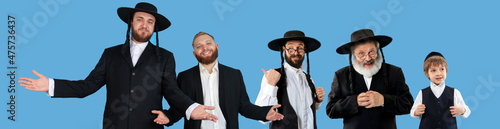 Set of portraits of mixed aged emotional men, orthodox jewish men standing together on blue background.