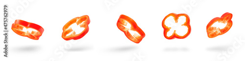 Set of slices of red pepper drops on a white background. Paprika flying in air on isolated white background