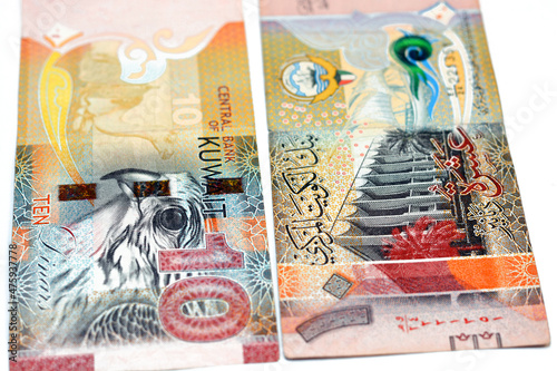 Ten Kuwaiti dinars bill banknote 10 KWD features The National Assembly of Kuwait, sambuk dhow ship, Falcon and camel dressed in a sadu saddle, Kuwaiti dinar is the currency of State of Kuwait isolated