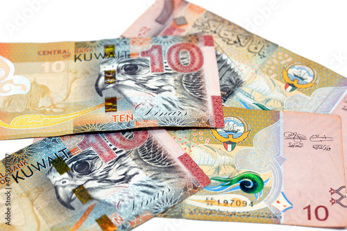 Ten Kuwaiti dinars bill banknote 10 KWD features The National Assembly of Kuwait, sambuk dhow ship, Falcon and camel dressed in a sadu saddle, Kuwaiti dinar is the currency of State of Kuwait isolated