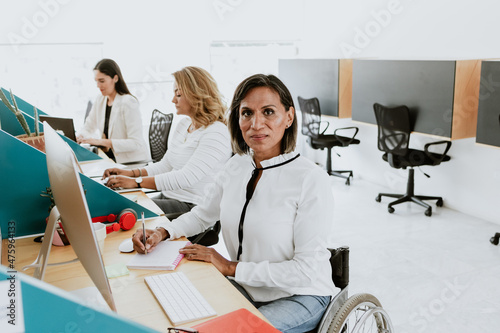 Latin transgender woman working with computer at the office in Mexico Latin America