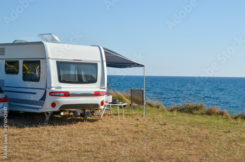 caravan trailer by the sea in summer holidays travel tourism