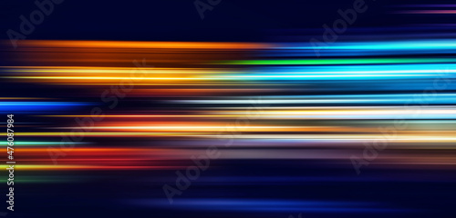 Abstract Rainbow light trails on the dark blue background. Motion blur illustration design.