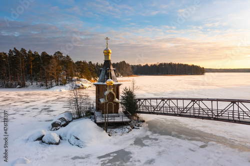 Karelia christmas. Russia temples. Church of Apostle Andrew First-Called on Vuoksa River. Small wooden church in middle of river. Travel to Karelia. Winter taiga landscape. Christmas in Russia