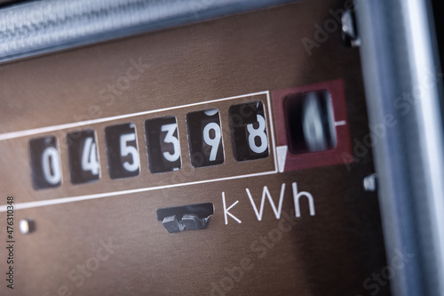 Close up of electricity meter with rotating digit.