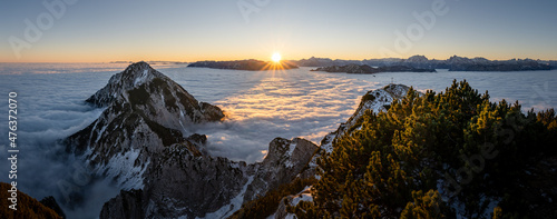 Berchtesgaden Alps at sunrise over a sea of clouds, Zwiesel summit cross, Bad Reichenhall, Bavaria, Germany