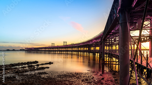 Panoramic view of the ore loading dock of the Rio Tinto mining company in Huelva, Andalusia, Spain. Sunset at the Muelle del Tinto