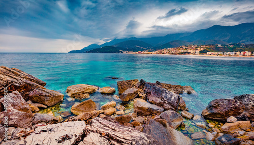 Incredible afternoon view of Potam Public beach. Dramatic spring seascape of Adriatic sea. Wonderful cityscape of Himare town, Albania, Europe. Traveling concept background.
