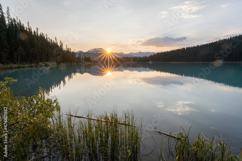 Sunrise above beautiful turquoise glacier lake with turquoise waters and reflections, Canada 