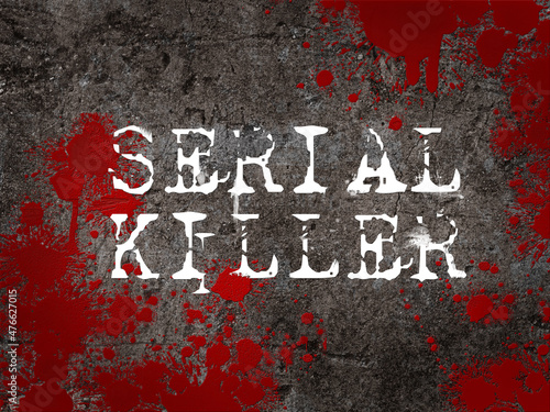 The word serial killer against a concrete floor splattered with blood. Criminal investigation case title.