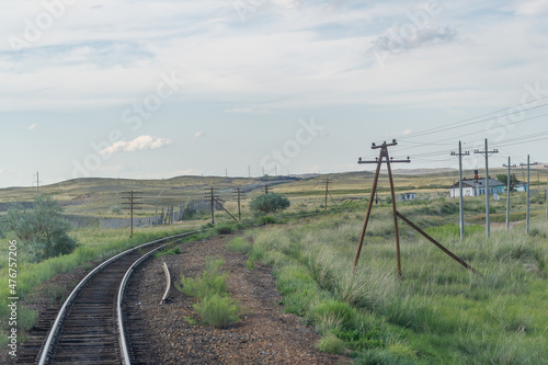 railway, railroad, rail, elevated. steppe prairie veld. is a means of transportation and passengers of trucks moving on rails that are located on the rails of the Great Plains. Kazakhstan 
