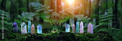 quartz Gemstones on mysterious forest natural background. minerals for esoteric Magic crystal Ritual, Witchcraft, spiritual practice. reiki healing therapy for life balance, soul relax. banner