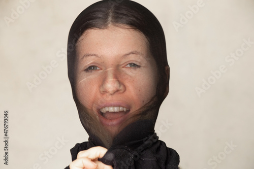 girl with a nylon black stocking on her head, anonymity, hide her face
