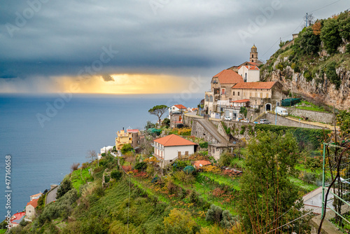 Amalfi coast near Furore, San Michele, Amalfi Coast, Italy, with Tyrrhenian Sea and sunset behind gray clouds