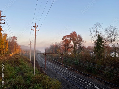 Morning shot of transit railroad tracks with no train on it during Covid-19 coronavirus omicron global pandemic. People use trains for commute, public transport.