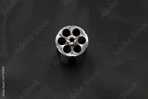 revolver cylinder on black background