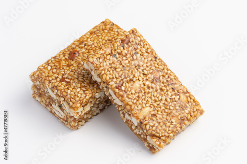 Indian sweets Mithai Gajjak Made Of til sesame seed Jaggery Gud Almonds Badam And Pistachio Also Known As til patti Gur Gajjak Gazak Gachak prepared during for Makar Sankranti Lohri