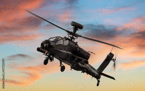 Apache attack helicopter at sunset