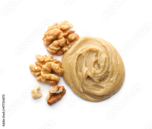 Delicious walnut butter and nuts on white background, top view