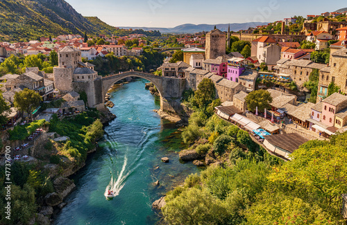 Breathtaking view of the historic Stari Most bridge in Mostar, Bosnia and Herzegovina, showcasing its stunning Ottoman architecture and the crystal-clear waters of the Neretva River