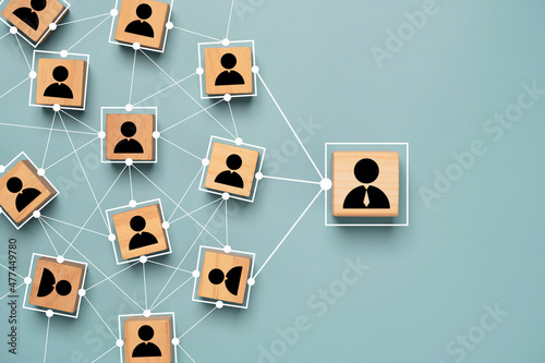 Manager and staff icon print screen on wooden cube block with connection link network for organisation structure in company social network and teamwork concept.