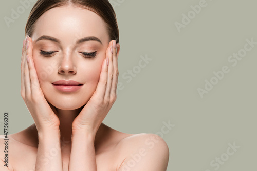 Skin care woman with hands portrait skin closeup cosmetic age concept. Color background green