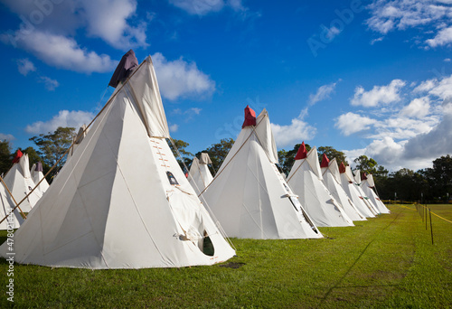 Byron Bay, Australia, Rainbow Tipi Village at the 2017 Byron Bay Bluesfest. 28th annual Blues and Roots festival. Field of white tipi tents. Camping festival accommodation.