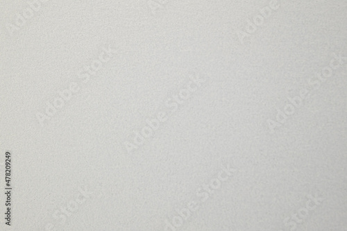 A dense industrial sheet of paper with a textured surface