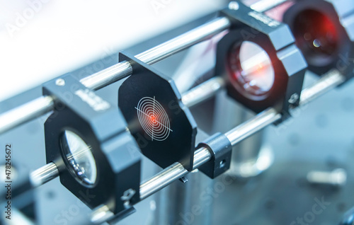 Experiment with laser device in optical laboratory