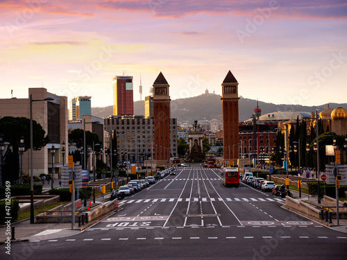 Urbanscape of Placa d'Espanya in Barcelona with view of twin Venetian Towers and fountain at centre of square.