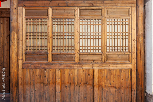 Part of The traditional wooden wall with lattice windows,