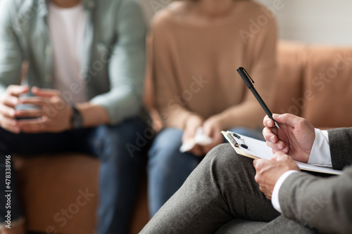 Couple having therapy session with male professional