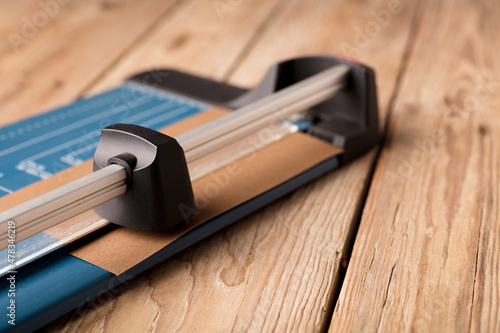 The blue paper guillotine used during the home office. Paper cutter 