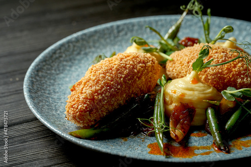 A classic dish of Ukrainian cuisine is a Kiev cutlet (chicken kiev) with mashed potatoes. Fried chicken with breadcrumbs