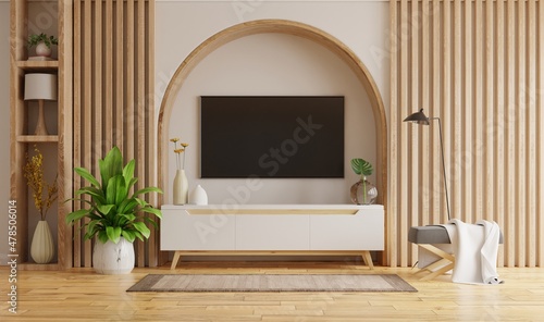 Living room interior with tv on cabinet and decorative lath on empty white wall background.