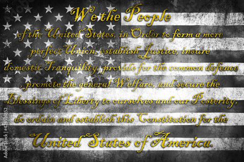 USA Constitution preamble We the People on grunge black and white US flag
