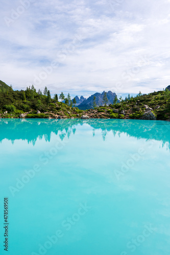 Lake Sorapis Italian Dolomites, Morning with clear sky on Lago di Sorapis in Italian Dolomites, lake with unique turquoise color water in Belluno province in Nothern Italy.