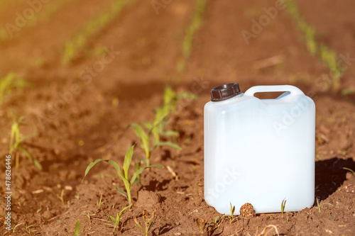 Herbicide plastic canister can in corn field