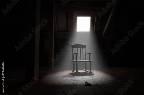 3d rendering of old rocking chair illuminated by light ray at dark attic. Concept age and past