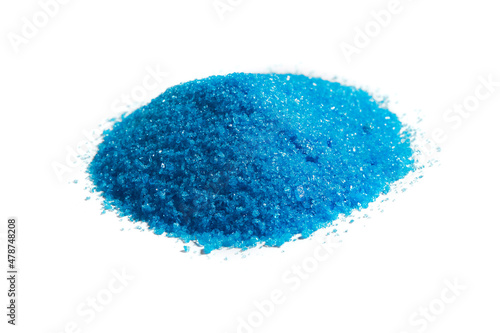 Cupric sulfate isolated on white. Bright, blue copper sulfate, CuSO4, also called blue vitriol or bluestone. Salt, used as algicide in swimming pools, for fireworks and in schools to grow crystals.