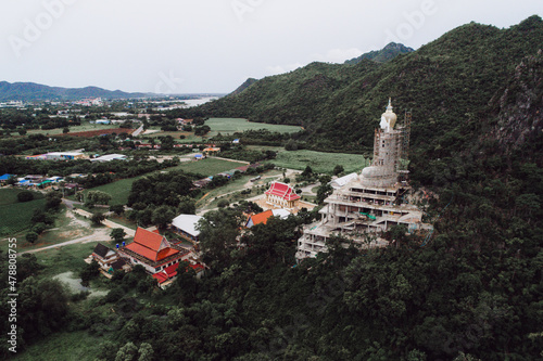 The temple is building a big Buddha image on the mountain.